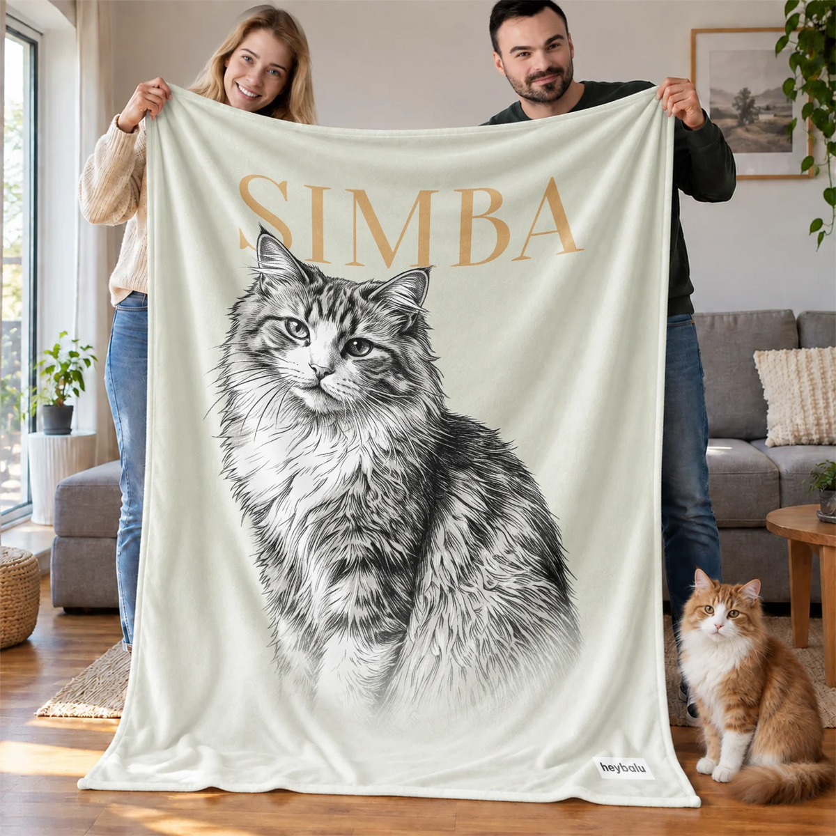 Paar hält die cremefarbene Retro-Katze-Decke mit Katzenzeichnung hoch